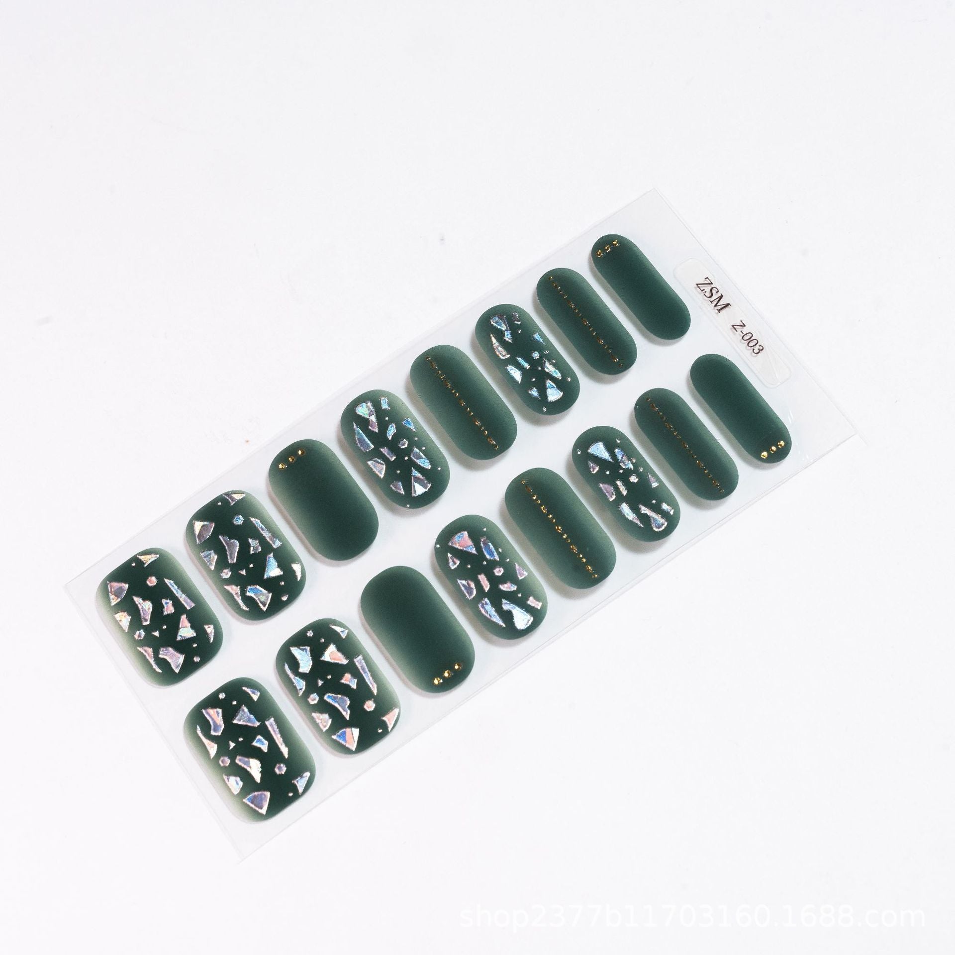 3D nail sticker set featuring dark green base with geometric and iridescent designs, arranged in a sheet.