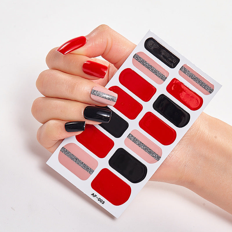 Every Shade of You nail wraps displayed on a hand with red, black, and silver designs.
