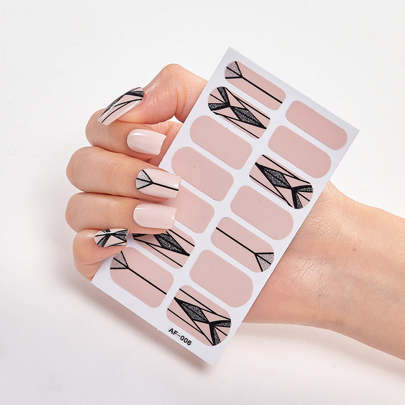 Every Shade of You nail art set featuring nude and black geometric designs on a hand with manicured nails.