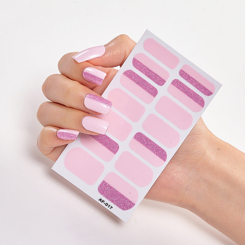 Every Shade of You nail wraps displayed on a hand with long pink nails and glitter accents.