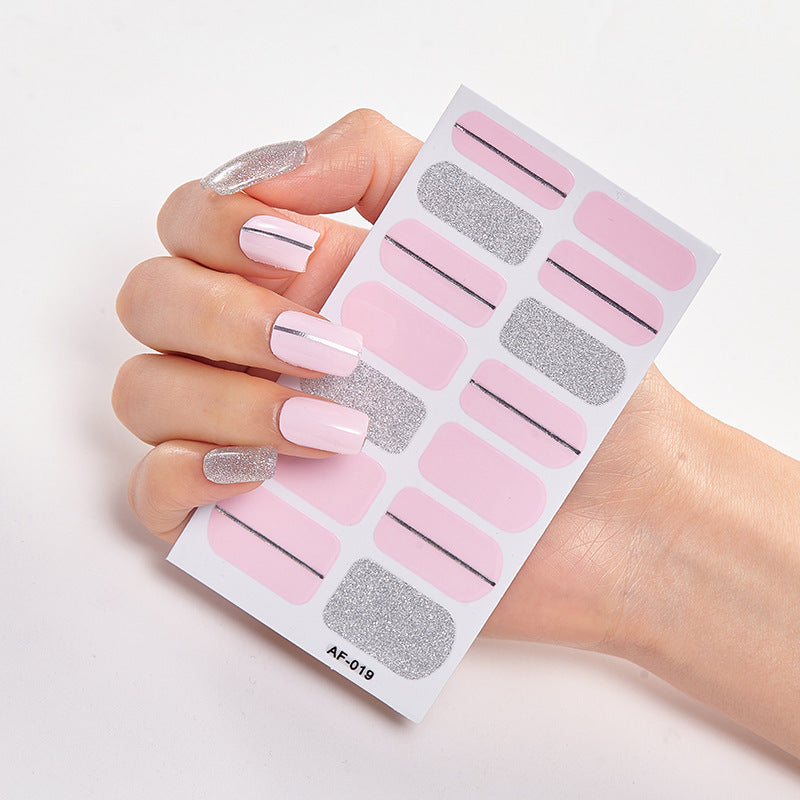 Every Shade of You nail art set featuring pink and silver designs on a hand with long nails.