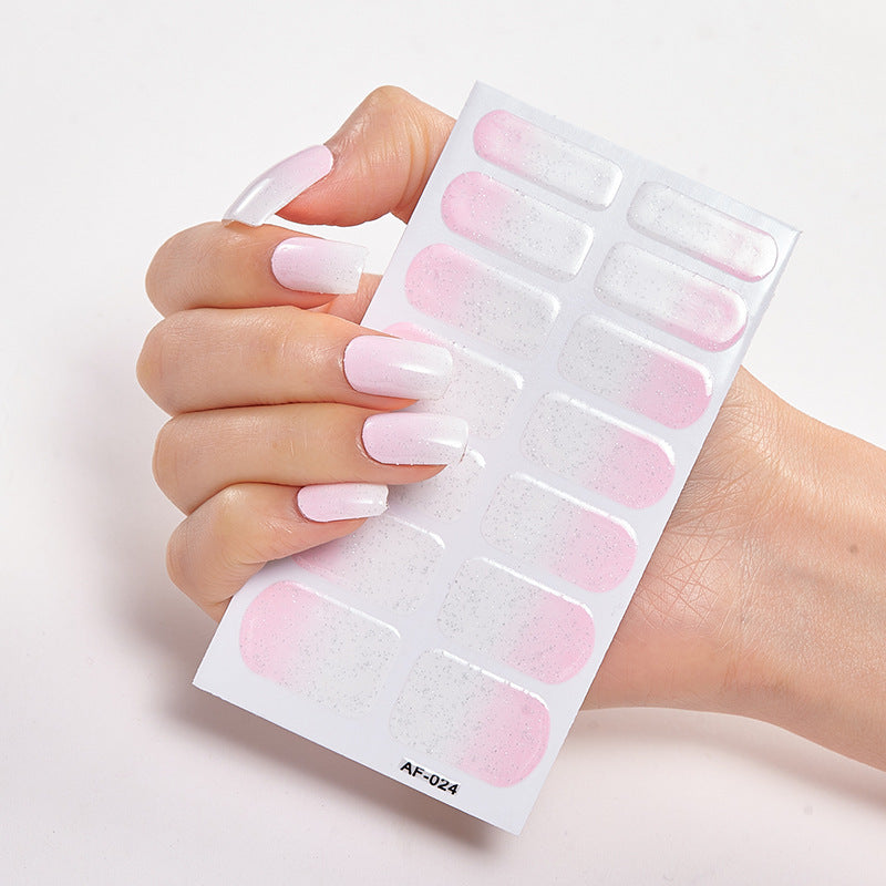 Every Shade of You nail wraps displayed on a hand, featuring pink ombre and glitter accents.