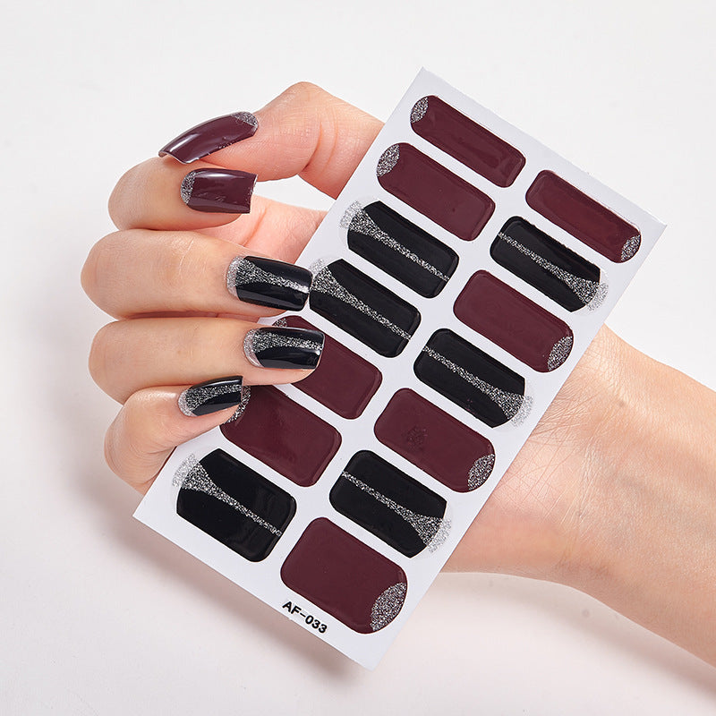 Every Shade of You nail wraps featuring dark burgundy and black designs with silver glitter accents.