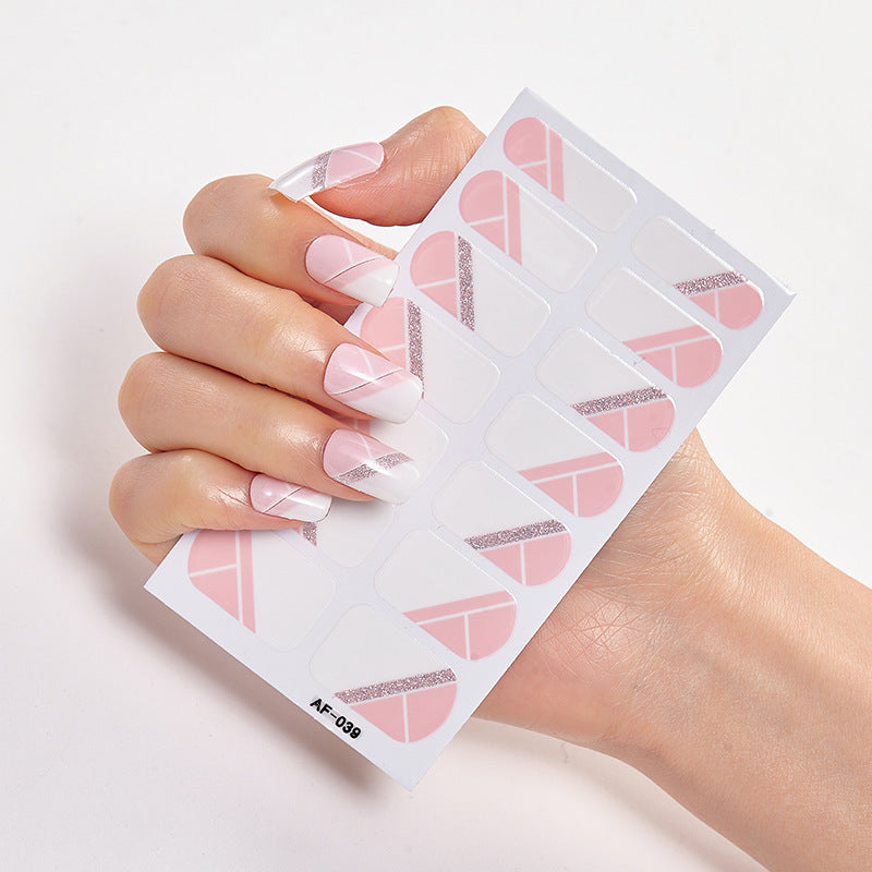 Every Shade of You nail art design featuring a hand holding a sheet of nail stickers with pink and silver patterns.