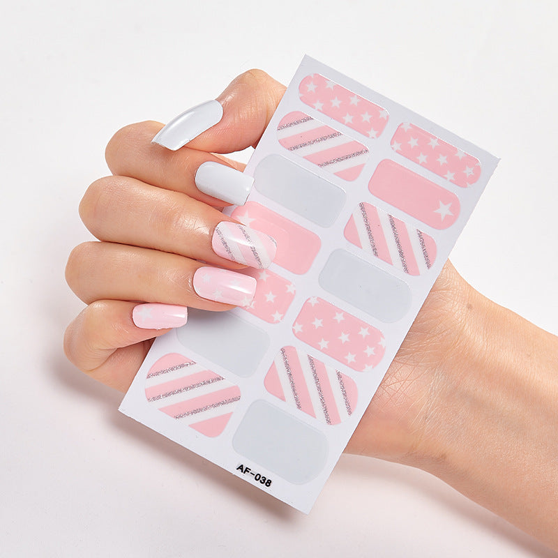 Every Shade of You nail art set featuring pink and silver designs on a hand with manicured nails.