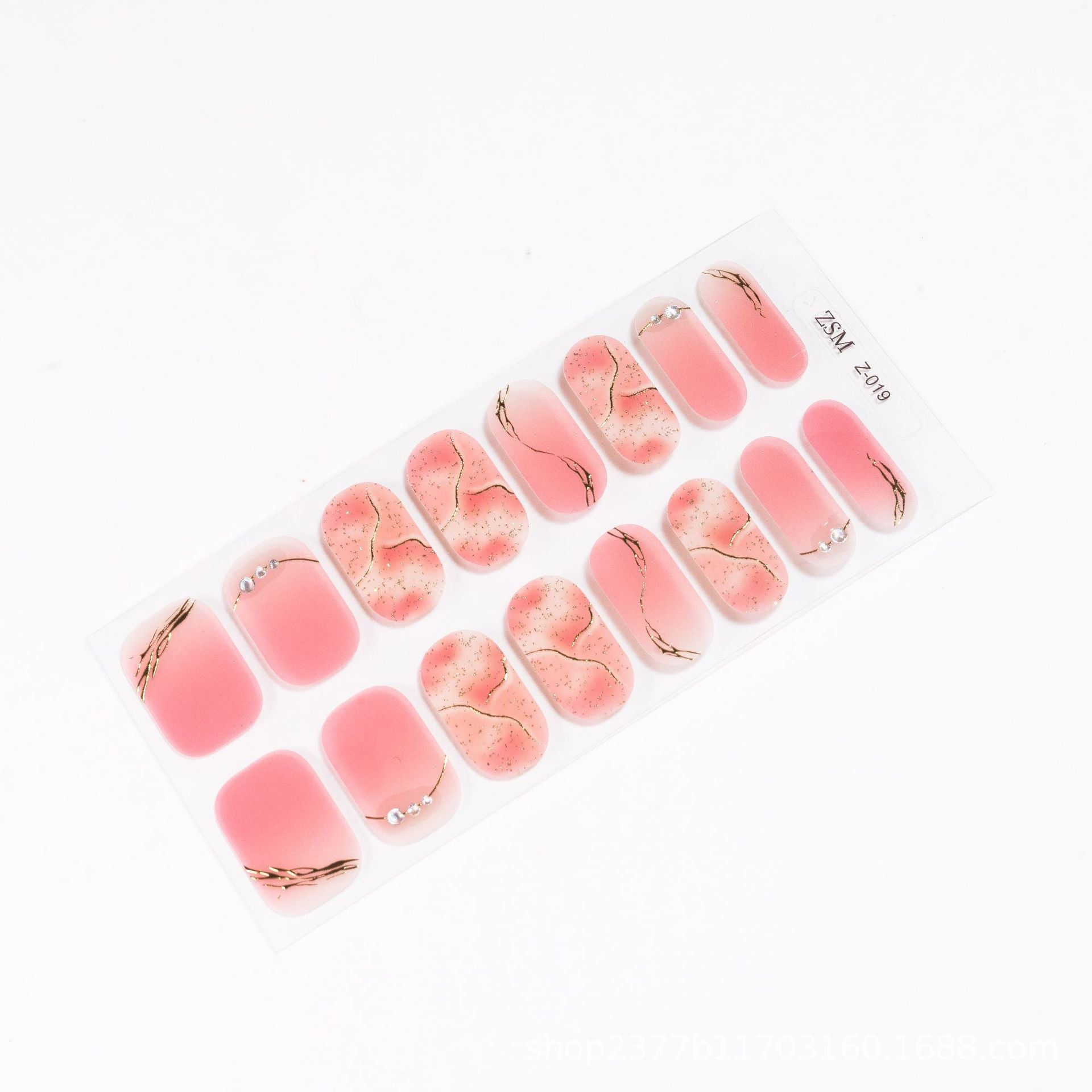 3D nail sticker sheet featuring pink and beige designs with gold accents and rhinestones.