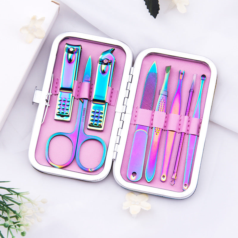 8-piece manicure set featuring rainbow-colored tools in a silver case with a pink interior.