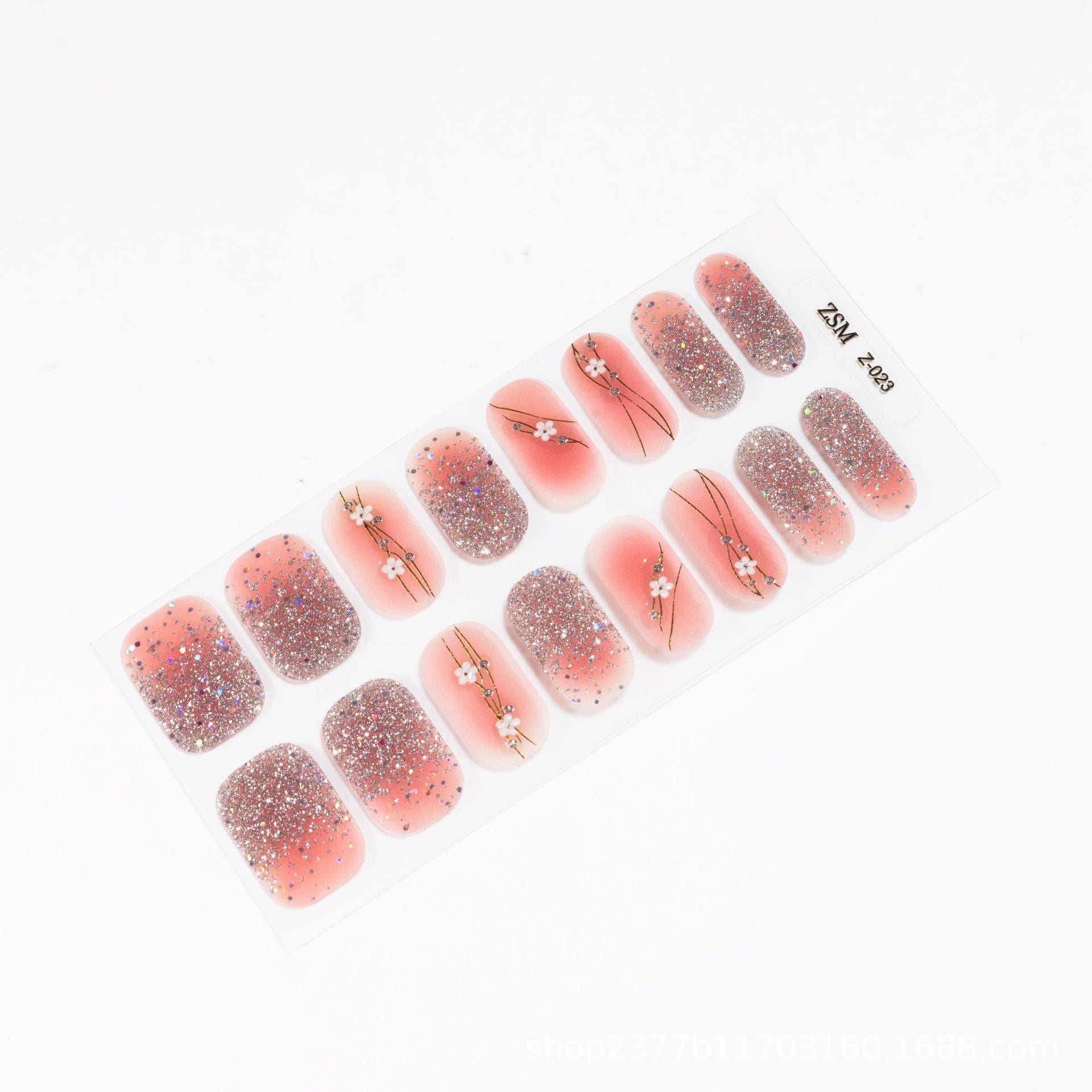 3D nail sticker set featuring pink and glitter designs with floral accents on a clear backing.
