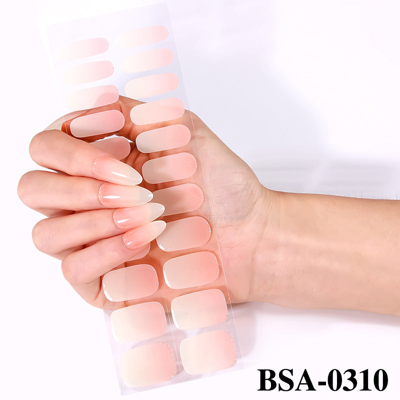 Pastel Non-UV nail tips displayed in a hand, featuring a gradient from soft pink to clear.