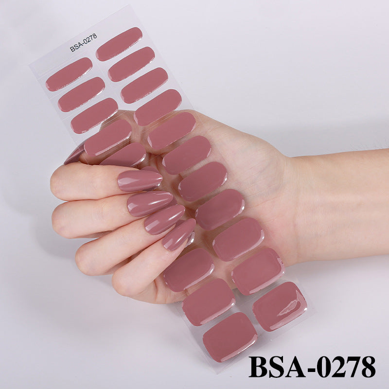 Pastel Non-UV nail wraps in a mauve shade displayed on a hand, showcasing various sizes and shapes.