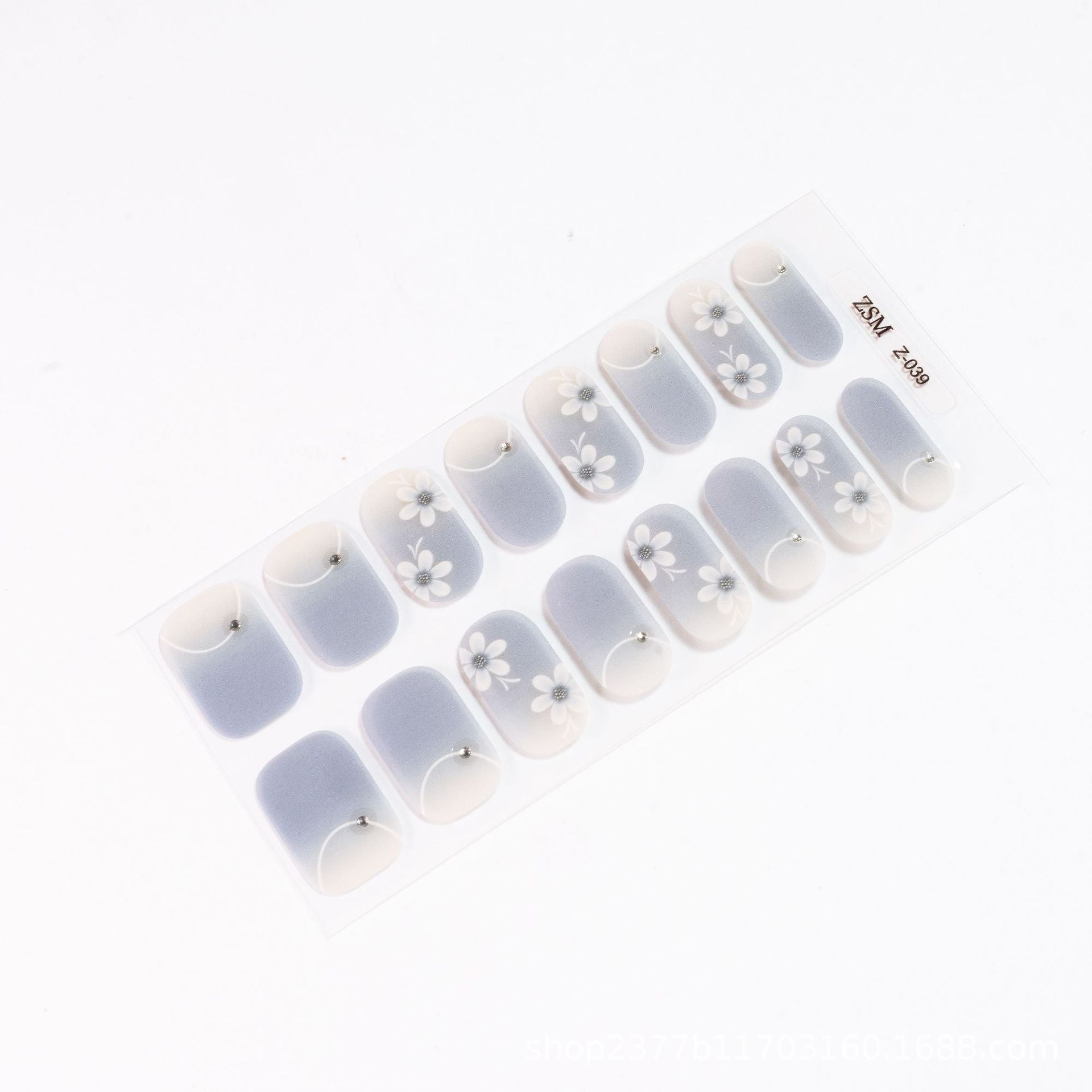 3D nail sticker sheet featuring light gray and white designs with floral patterns and rhinestone accents.