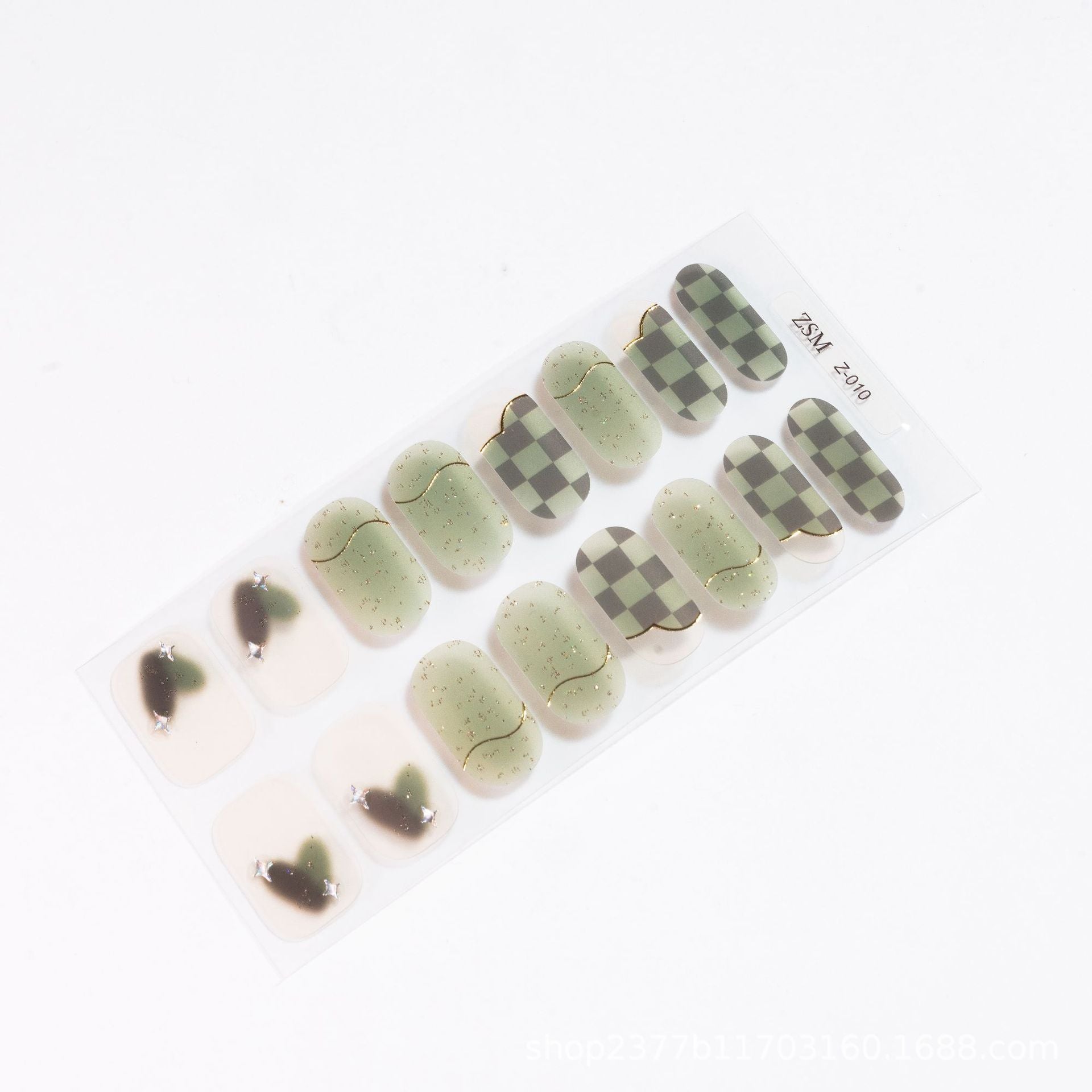 3D nail sticker sheet featuring various designs in green, beige, and black patterns, including checkered and heart shapes.
