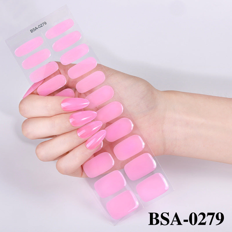 Pastel Non-UV nail tips in a glossy pink finish, displayed on a hand with long, pointed nails.