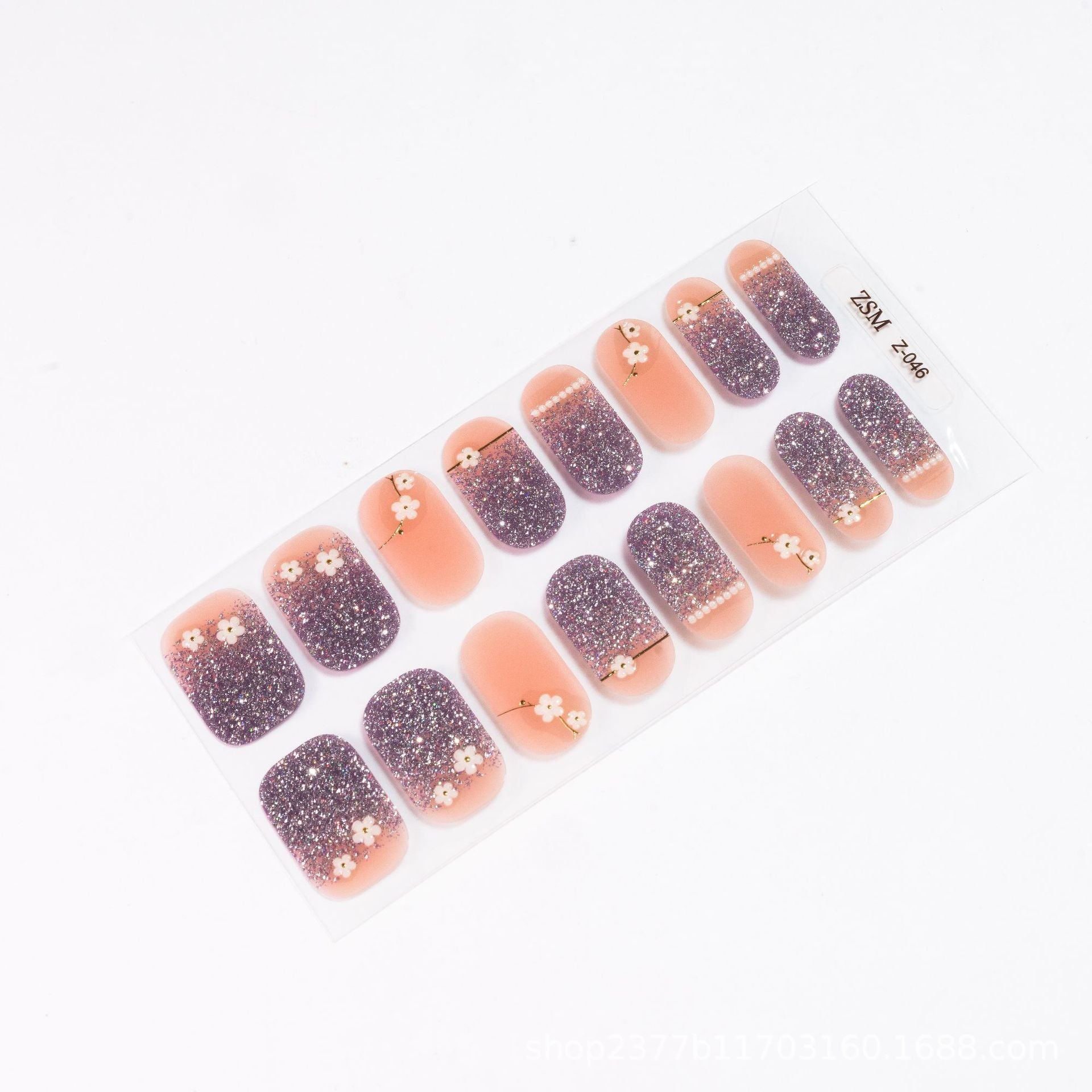 3D nail sticker set featuring pink and purple designs with floral accents on a clear backing.