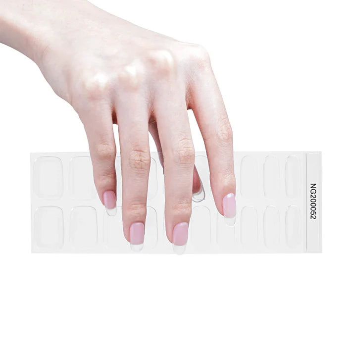 A hand with light pink nails holding a transparent nail tip display with various nail shapes.