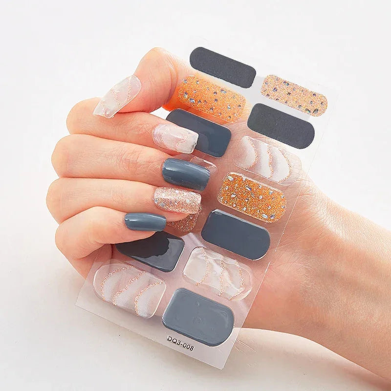 Currant™ Marble nail stickers displayed on a hand with various designs, including glitter and solid colors.