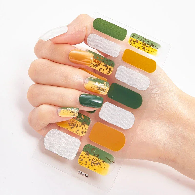 Currant™ Marble nail wraps featuring green, yellow, and white designs with a speckled texture on a clear sheet.