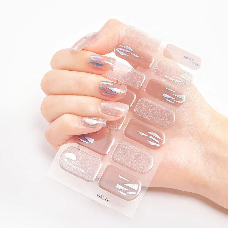 Currant™ Marble press-on nails in a light pink shade with iridescent accents and a glossy finish.