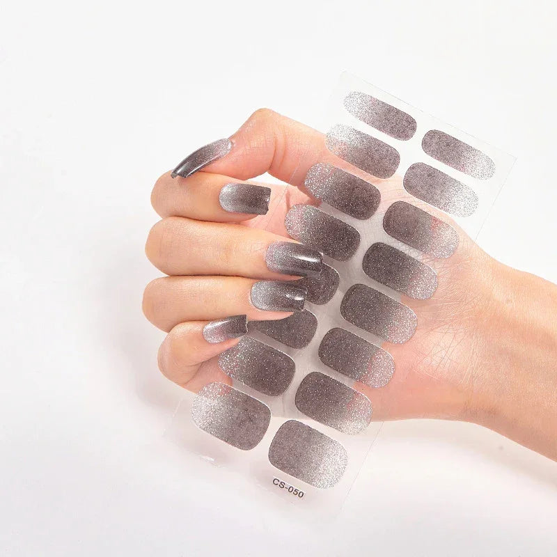 Currant™ Fade nail wraps displayed on a hand with long, glittery silver nails against a white background.