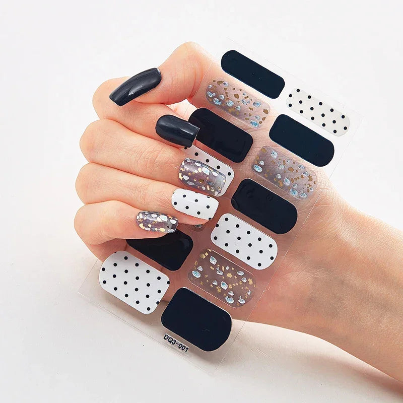 Currant™ Marble nail wraps featuring black, white, and silver glitter designs on a clear backing.
