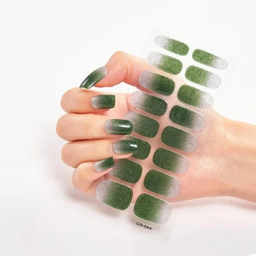 Currant™ Fade nail wraps featuring a gradient green design, displayed on a hand with manicured nails.