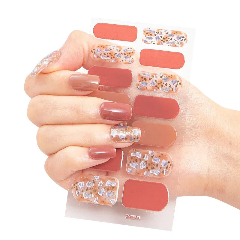Currant™ Marble nail stickers featuring a mix of solid and patterned designs in warm tones and glitter accents.