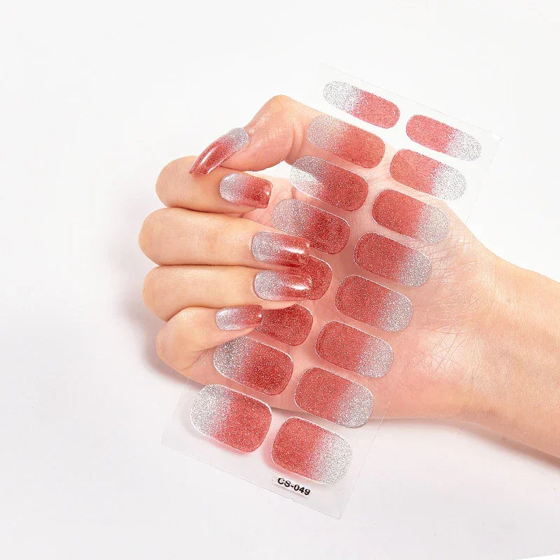 Currant™ Fade nail wraps featuring a gradient design from red to silver, displayed on a hand with manicured nails.