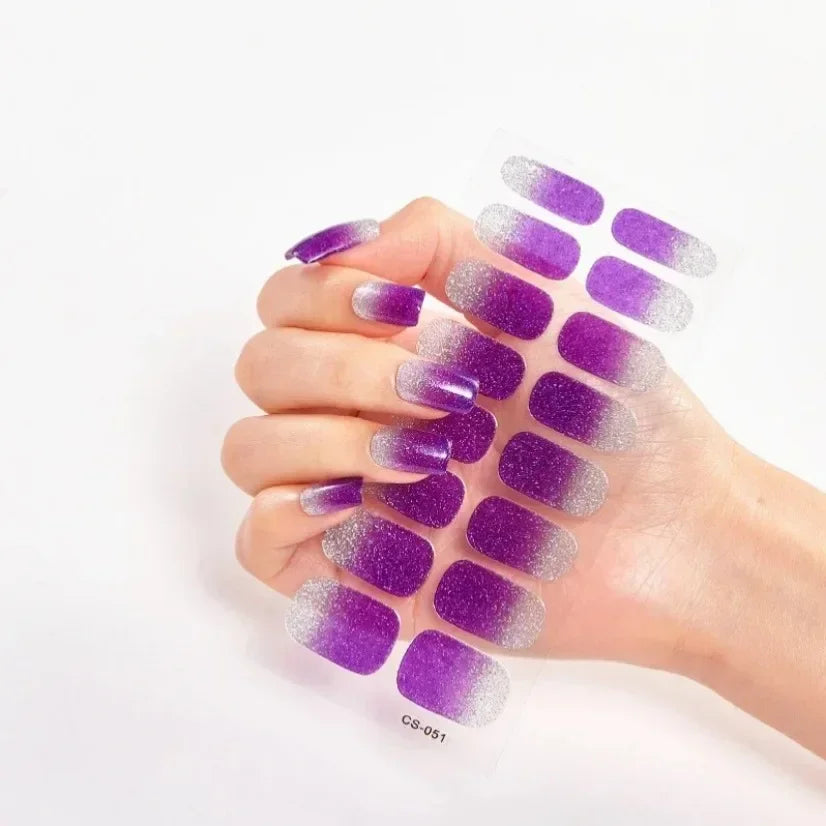 Currant™ Fade nail wraps featuring a gradient from deep purple to silver, displayed on a hand with manicured nails.