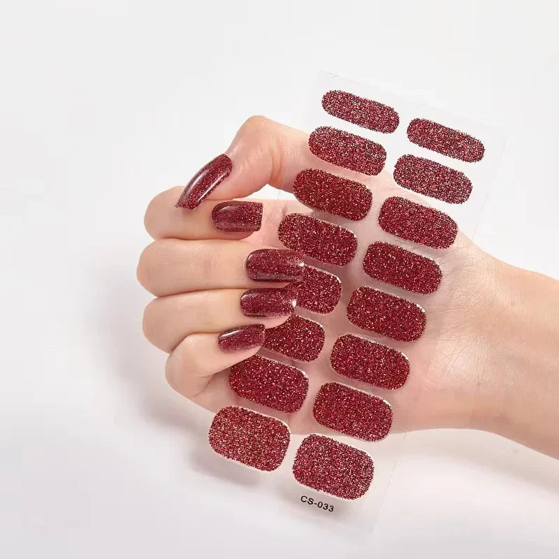 Currant™ Star nail wraps featuring deep red glitter design, displayed on a hand with manicured nails.