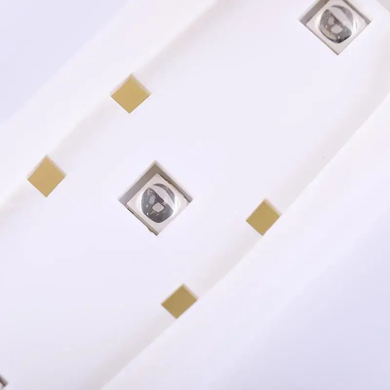 Currant UV lamp with a sleek white design and square light openings for effective UV treatment.