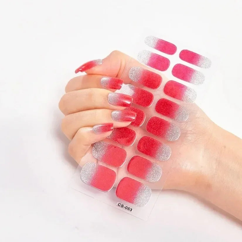 Currant™ Fade nail strips featuring a gradient from red to silver, displayed on a hand with manicured nails.