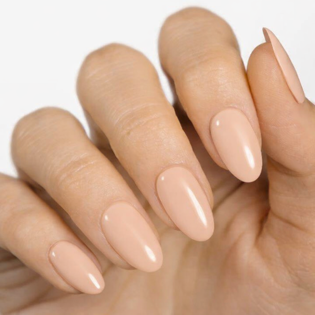 Currant™ nail wraps displayed on well-manicured hands with almond-shaped, nude-colored nails.