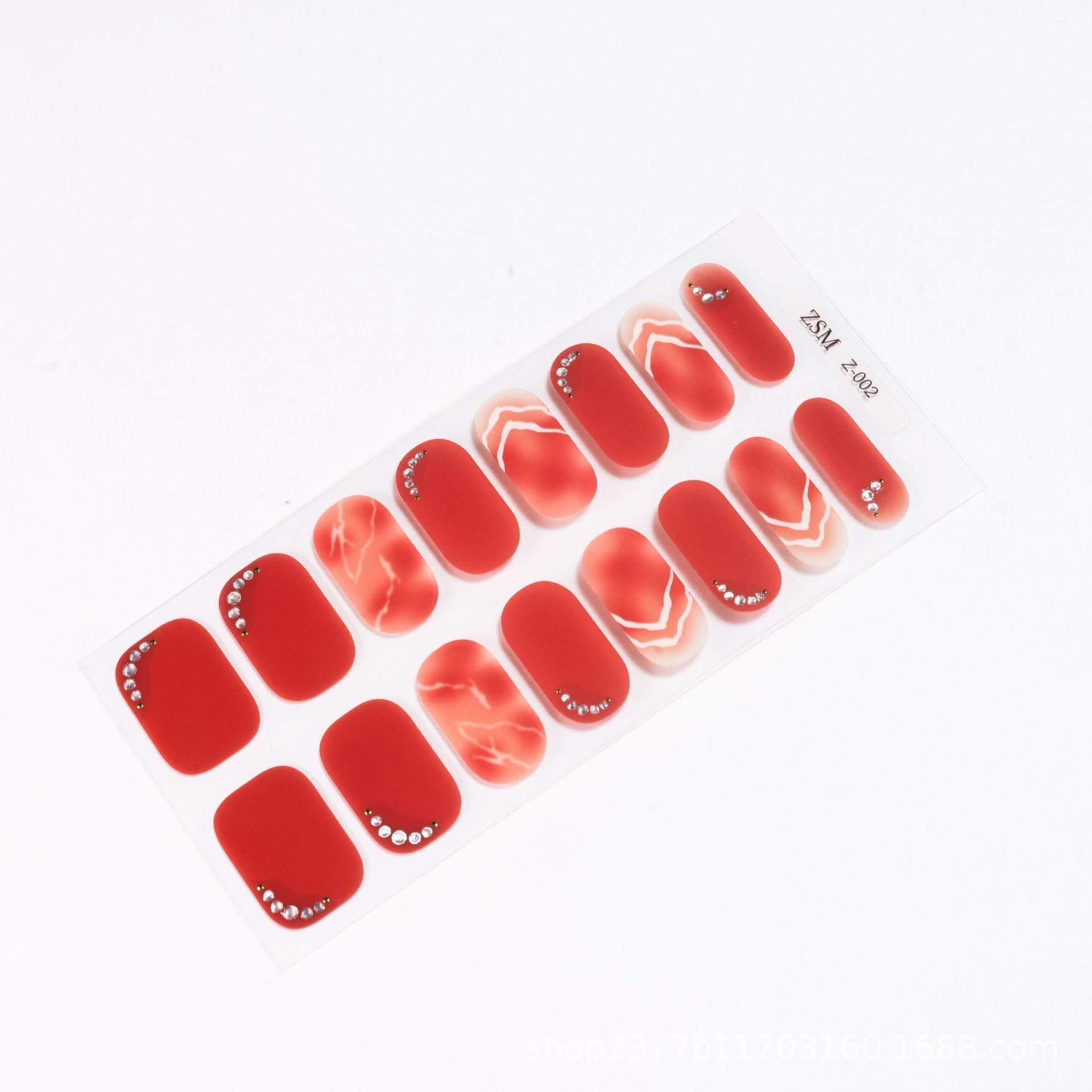 Red 3D nail stickers featuring various designs, including solid colors and marbled patterns, arranged on a clear backing.
