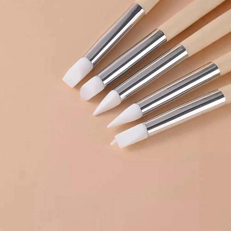 Application wand set with five tools featuring white tips and wooden handles on a beige background.